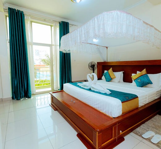 Executive Suite at Classic Hotel Kigali with king bed and sitting area